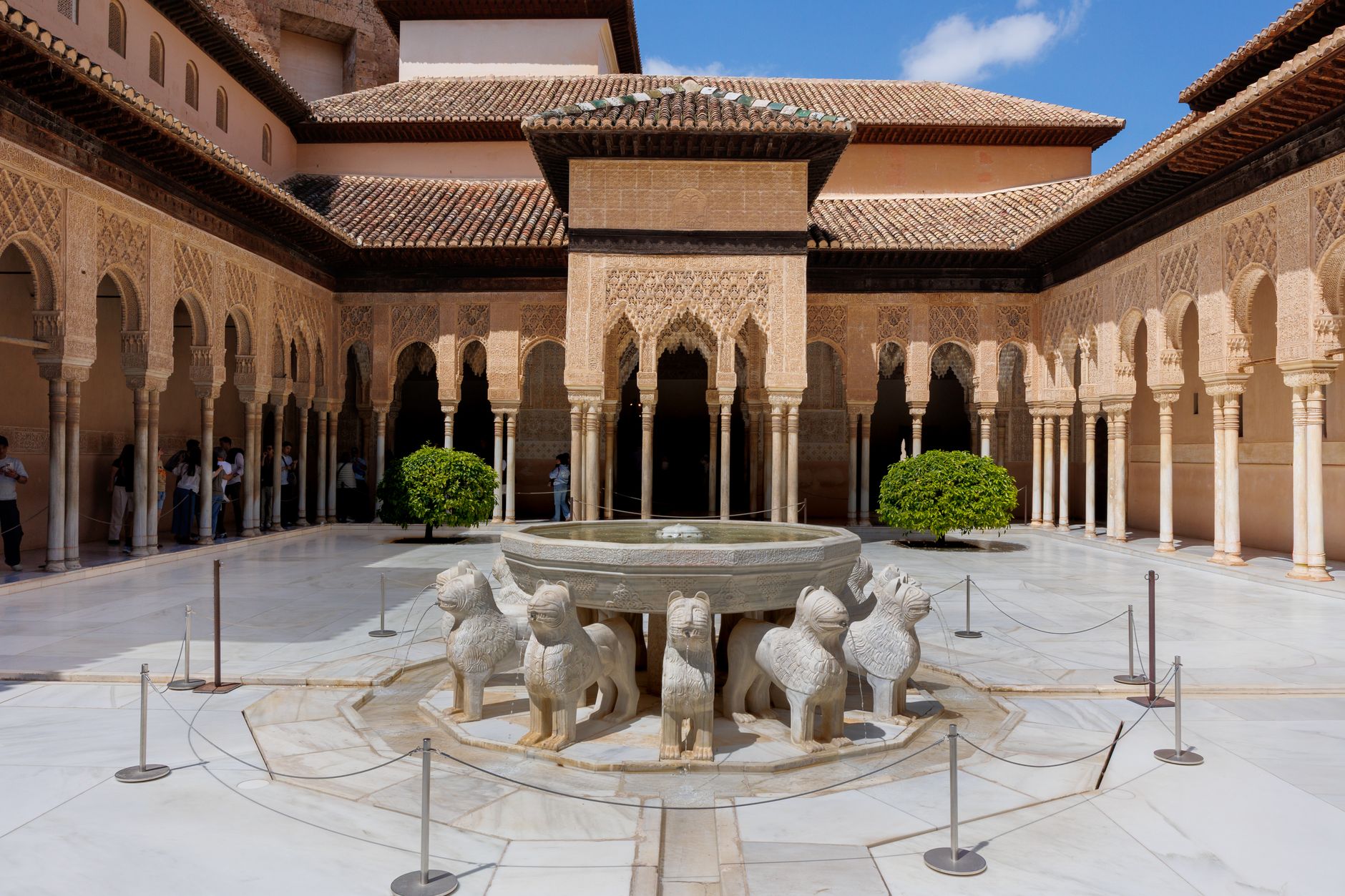 The Court of the Lions in the Alhambra, the marble fountain with twelve lions ringed by slender columns