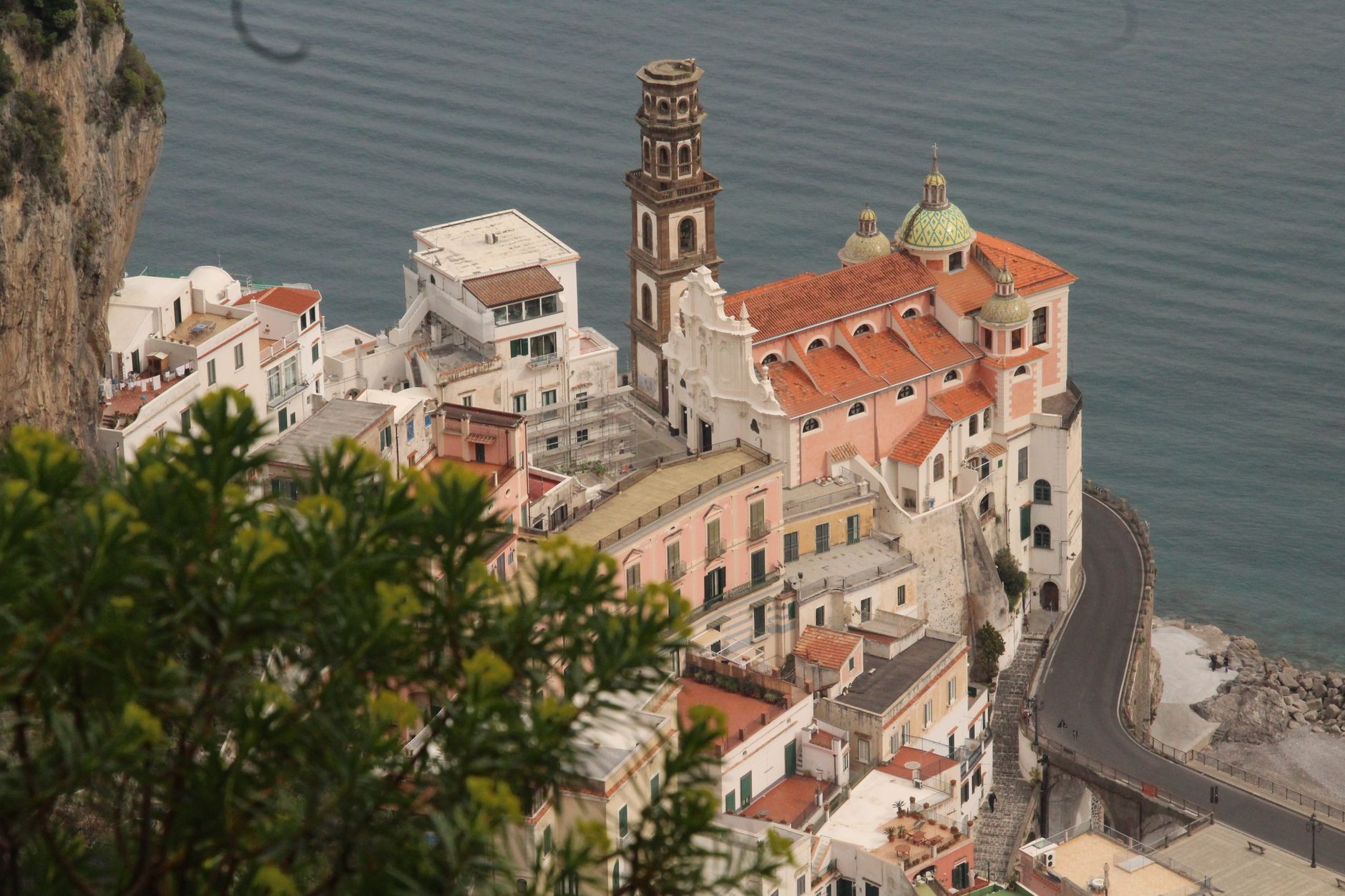 The village of Atrani stacked above the sea, its majolica-domed church and bell tower on the Amalfi Coast