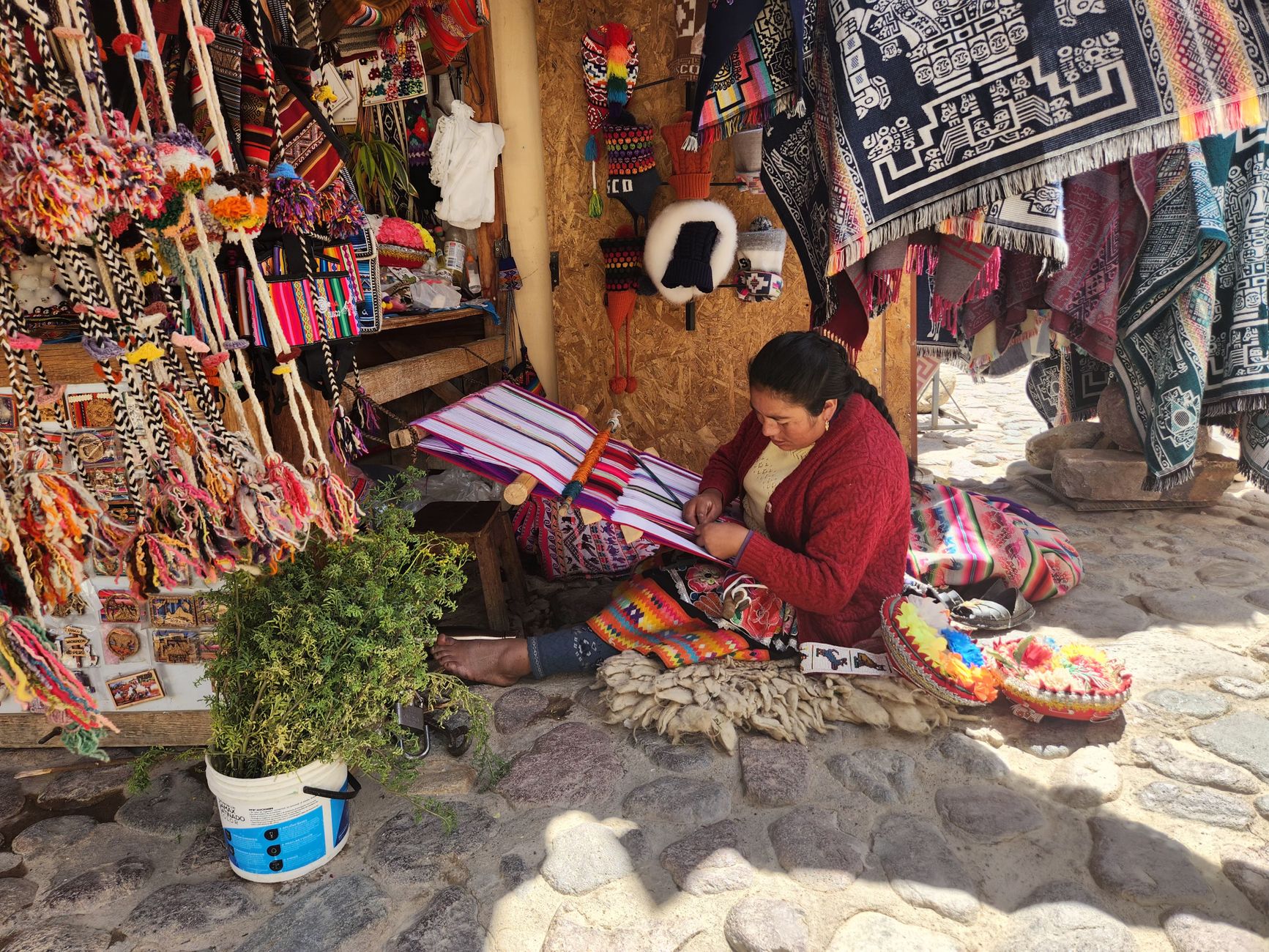 A woman weaving traditional Andean textiles