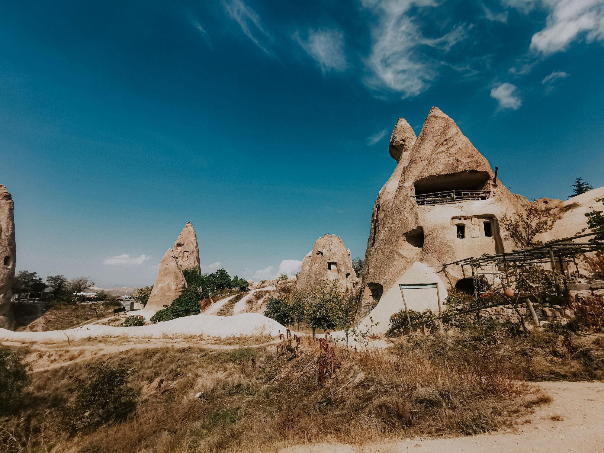 Fairy chimneys of Cappadocia with cave dwellings carved into the soft volcanic rock