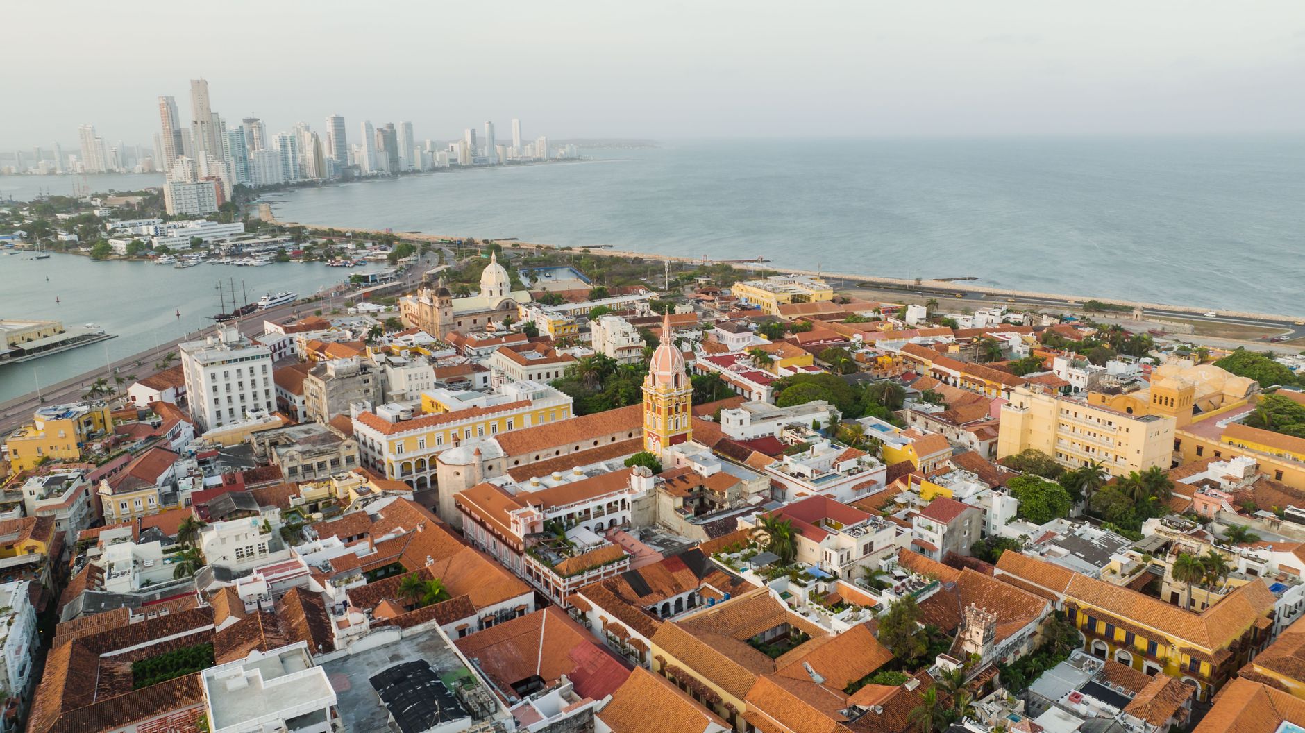 The walled centre of Cartagena seen from above, terracotta roofs inside the line of the ramparts
