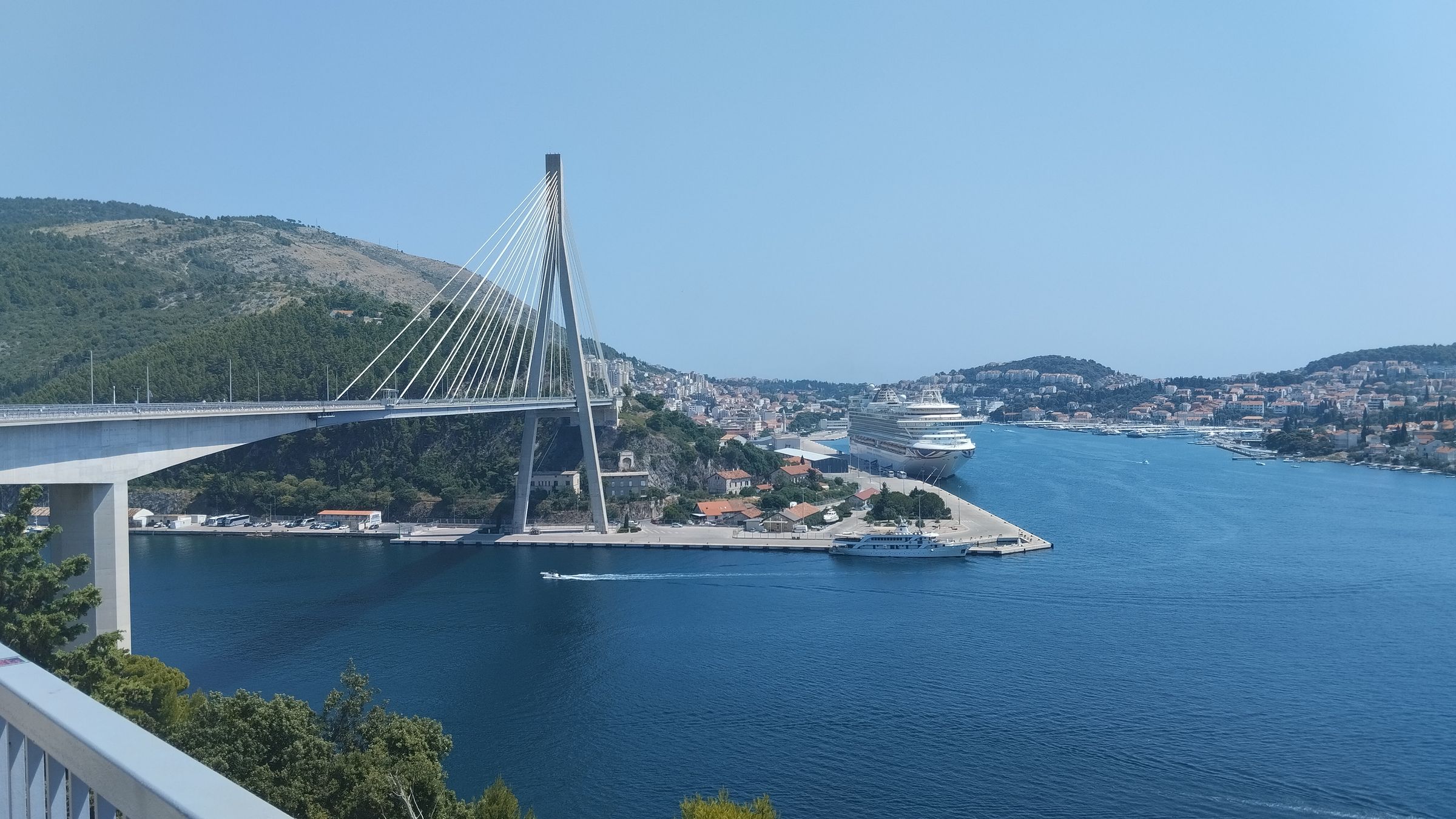 The Franjo Tudjman bridge over the mouth of Gruz harbour, a ship at the berth beyond