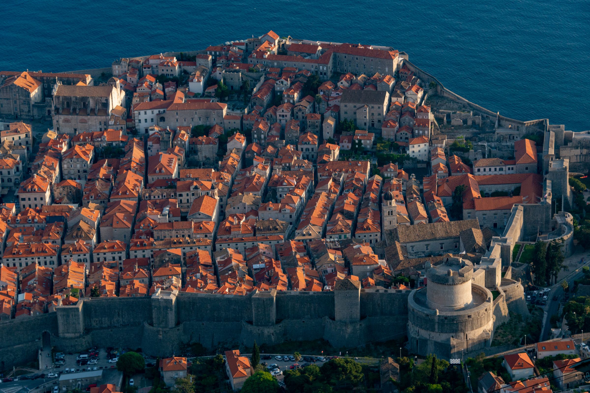 The city walls and the terracotta roofs of the old town from above