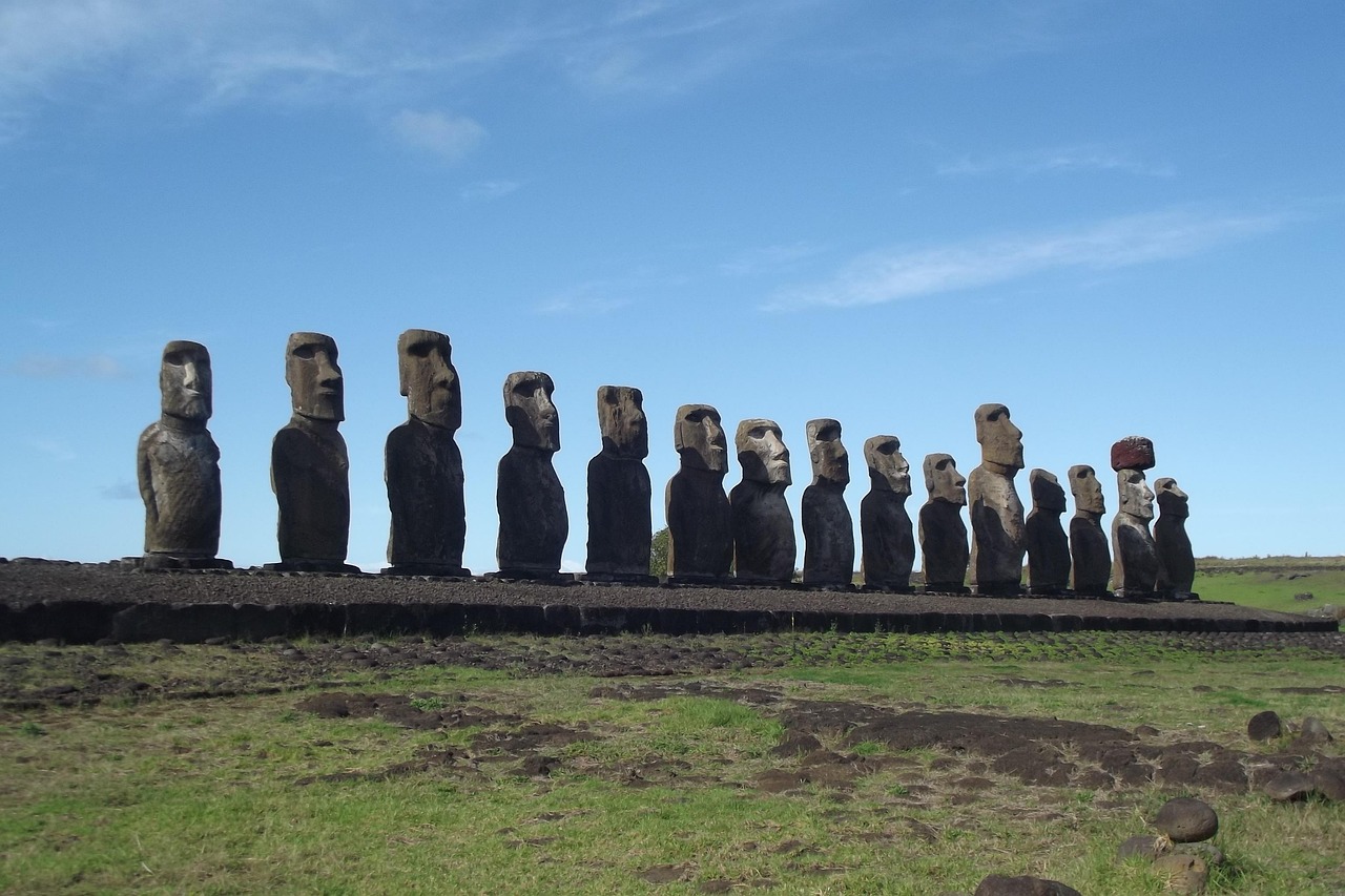 The fifteen moai of Ahu Tongariki in daylight, one wearing a red stone topknot
