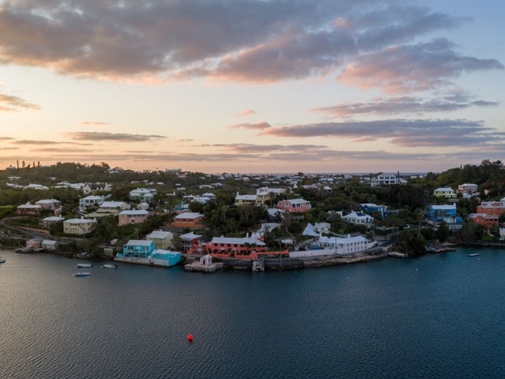 Painted houses on the water in Bermuda at dusk