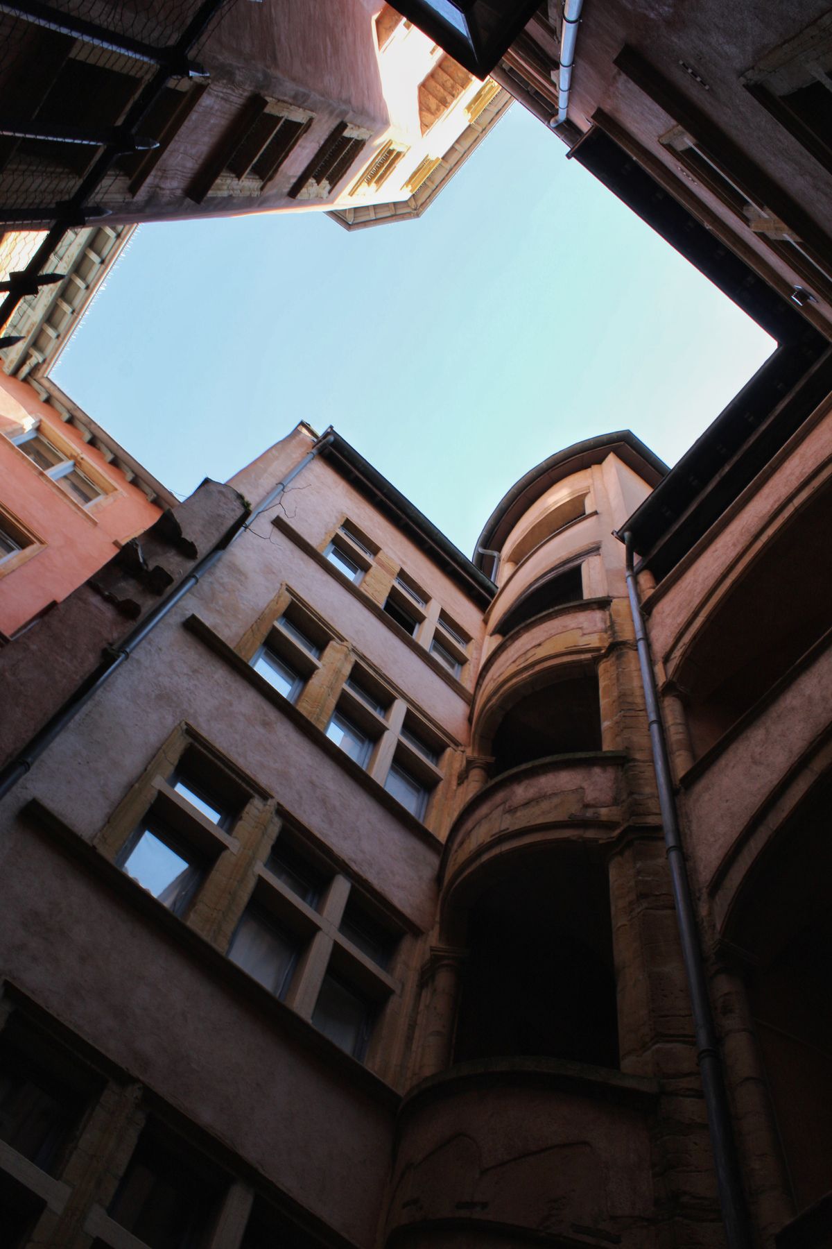 Looking up from a Renaissance courtyard with a stair tower in Vieux Lyon