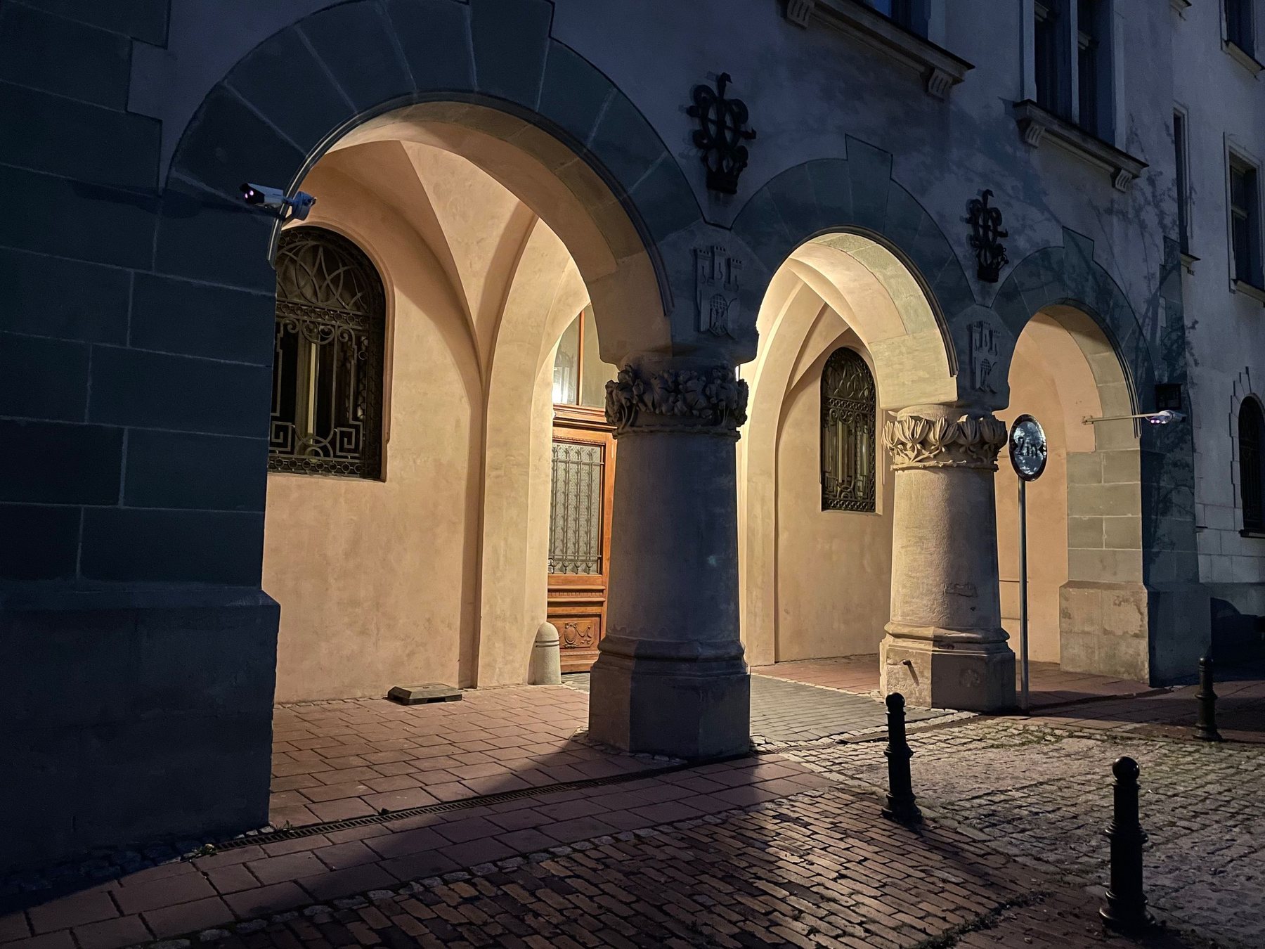 The arcade of the Cloth Hall in Kraków, lit at night