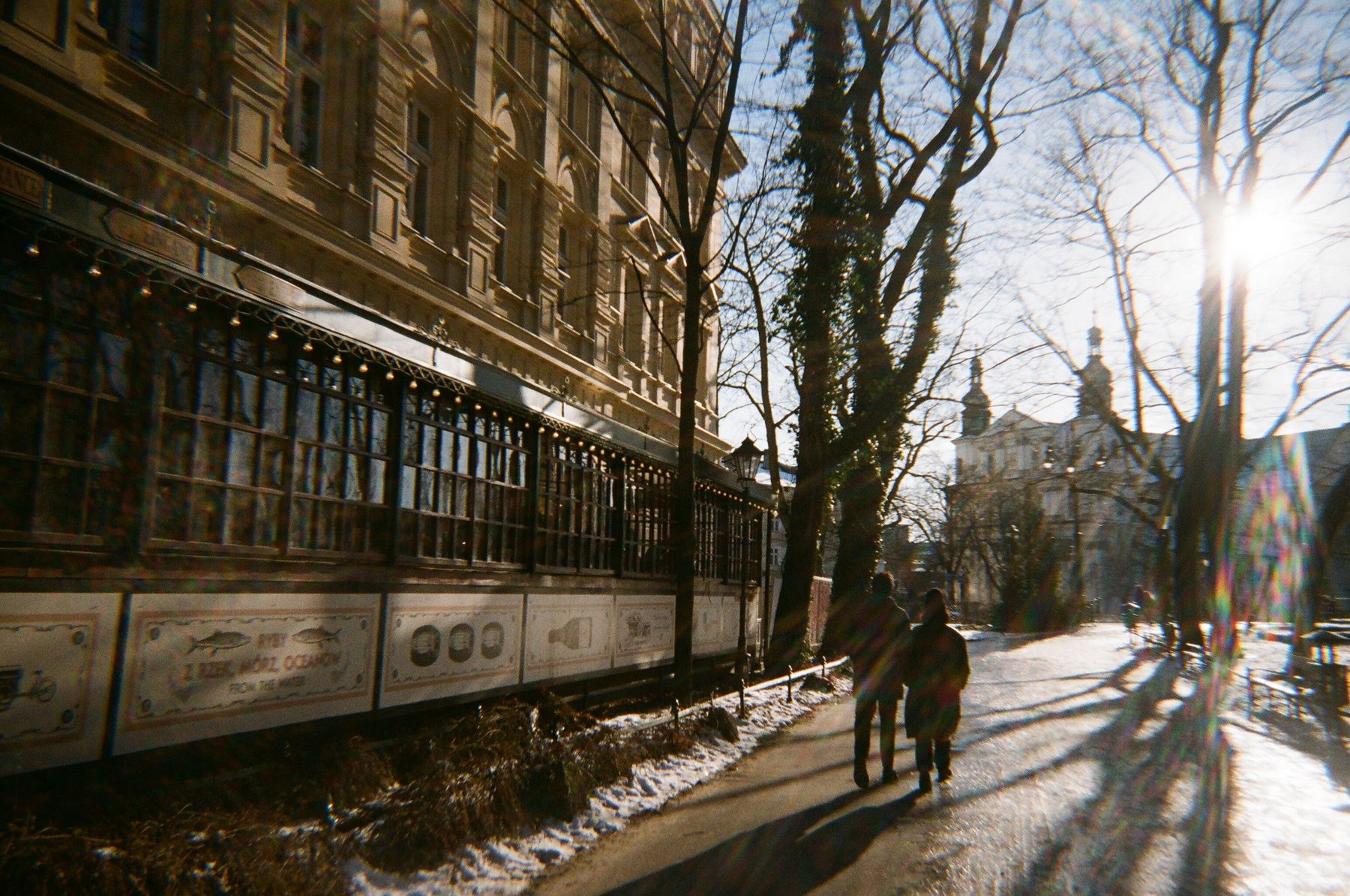 A sunlit winter street in Kraków