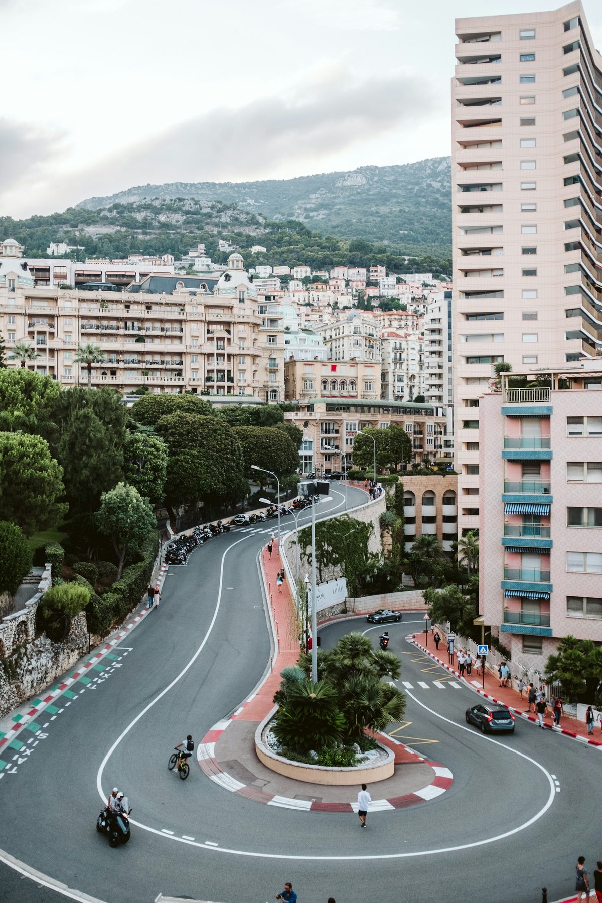 The Fairmont hairpin from above on an ordinary day, with scooters and cars rounding the bend between apartment blocks