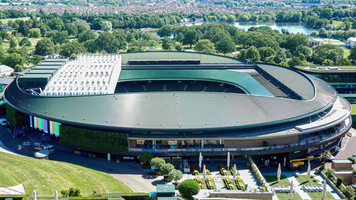 A show court at the All England Club from the air, with the lake in Wimbledon Park behind it