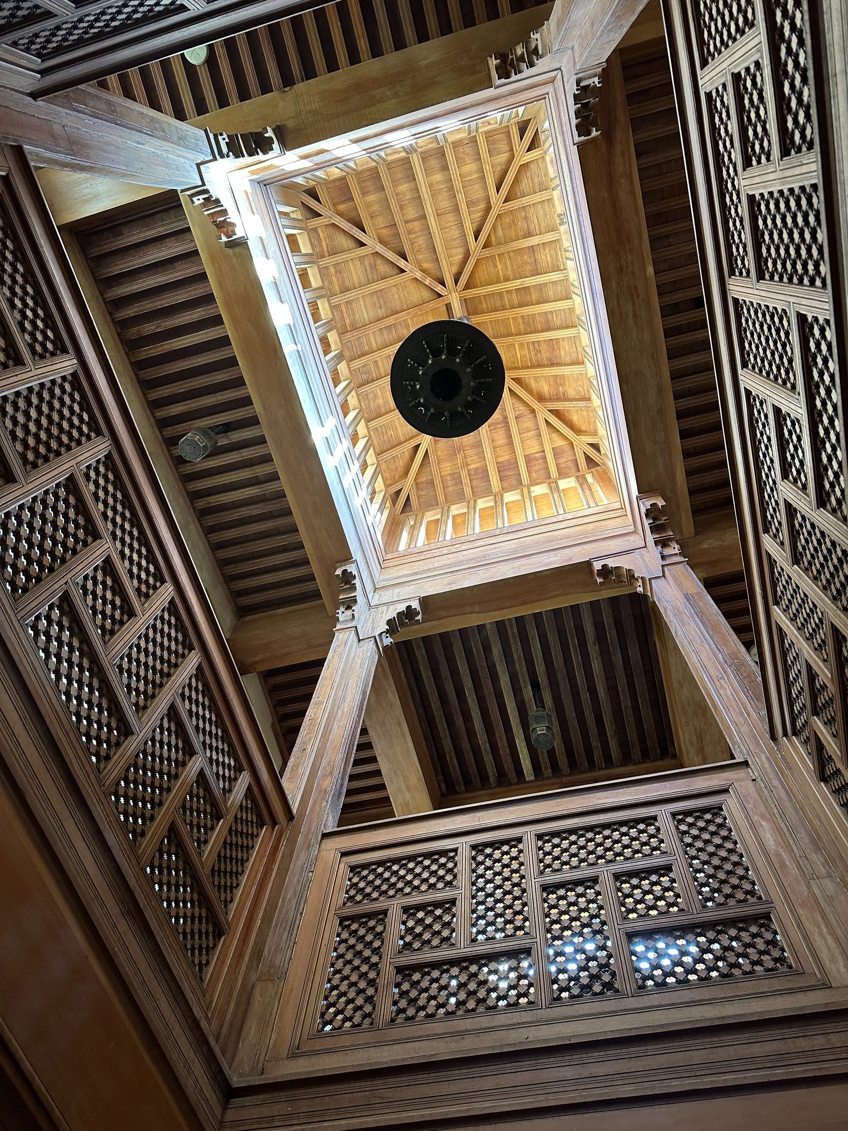 The carved cedar galleries and skylight of the Nejjarine wood museum in Fez