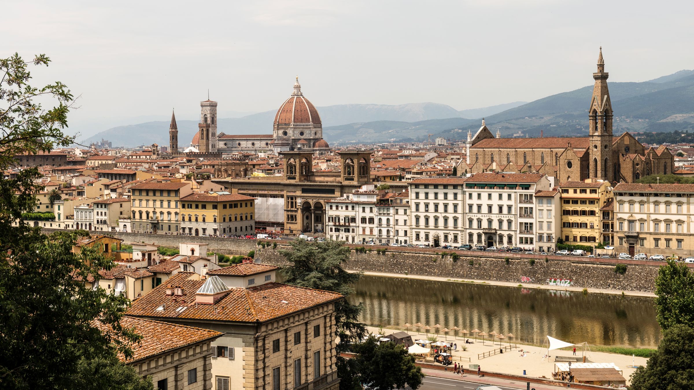 Florence from Piazzale Michelangelo: the cathedral dome and bell tower, the Gothic church of Santa Croce, the Arno below and hills behind