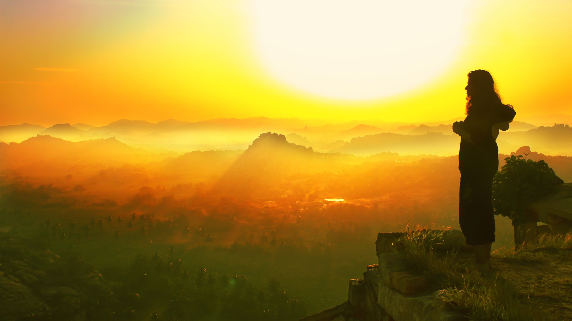 A panorama of Hampi's ruins and boulders from Matanga Hill in the low golden light of dawn