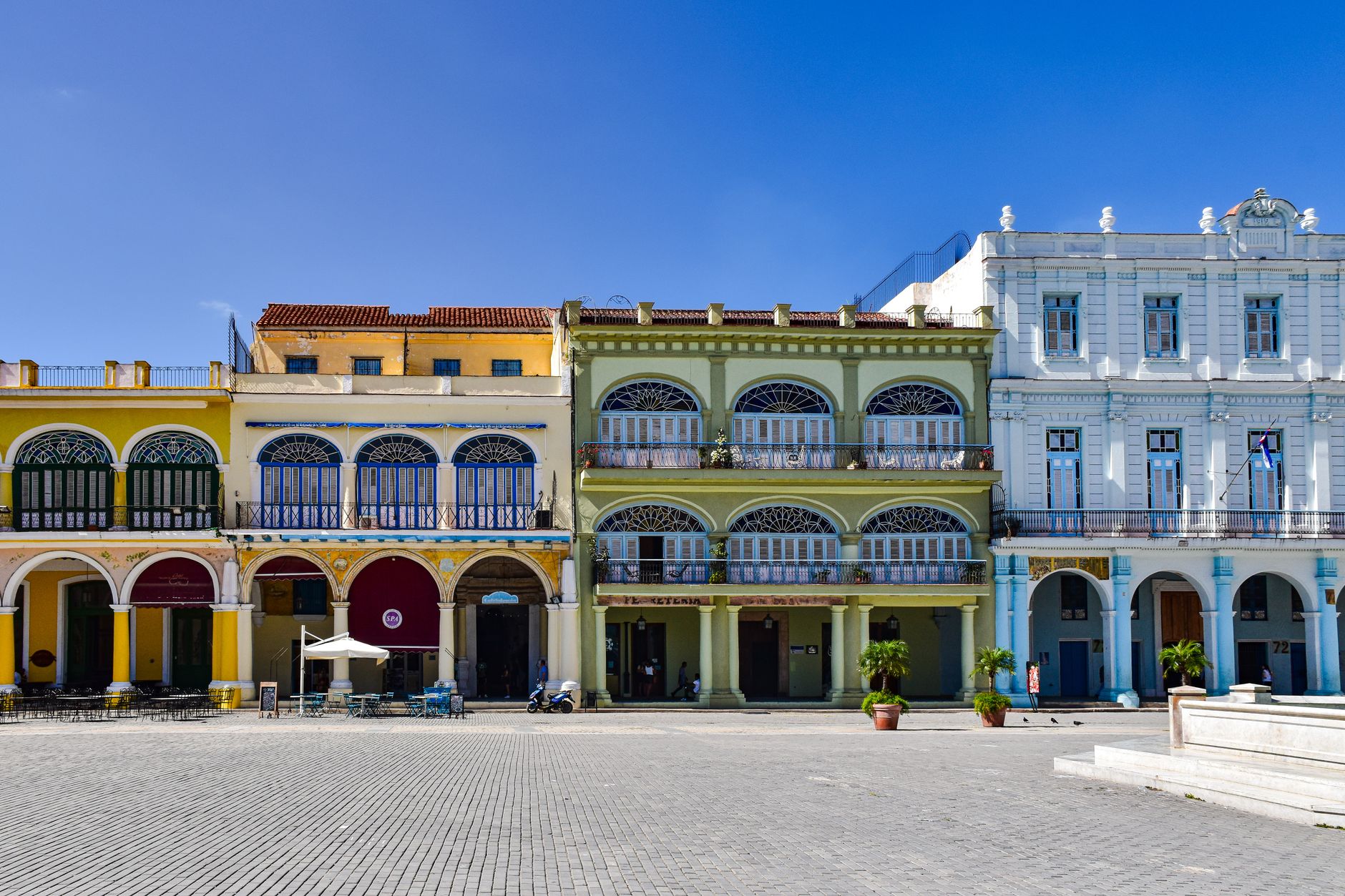 The restored arcaded colonial facades around Plaza Vieja in Old Havana
