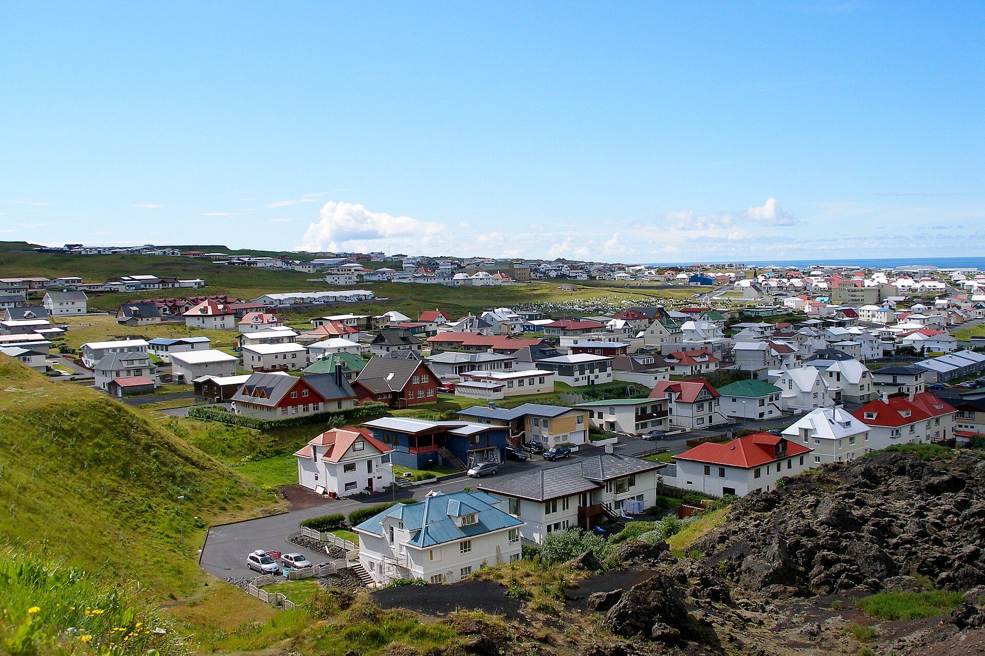 The town of Heimaey seen from above, with lava from the 1973 eruption ending just short of the houses