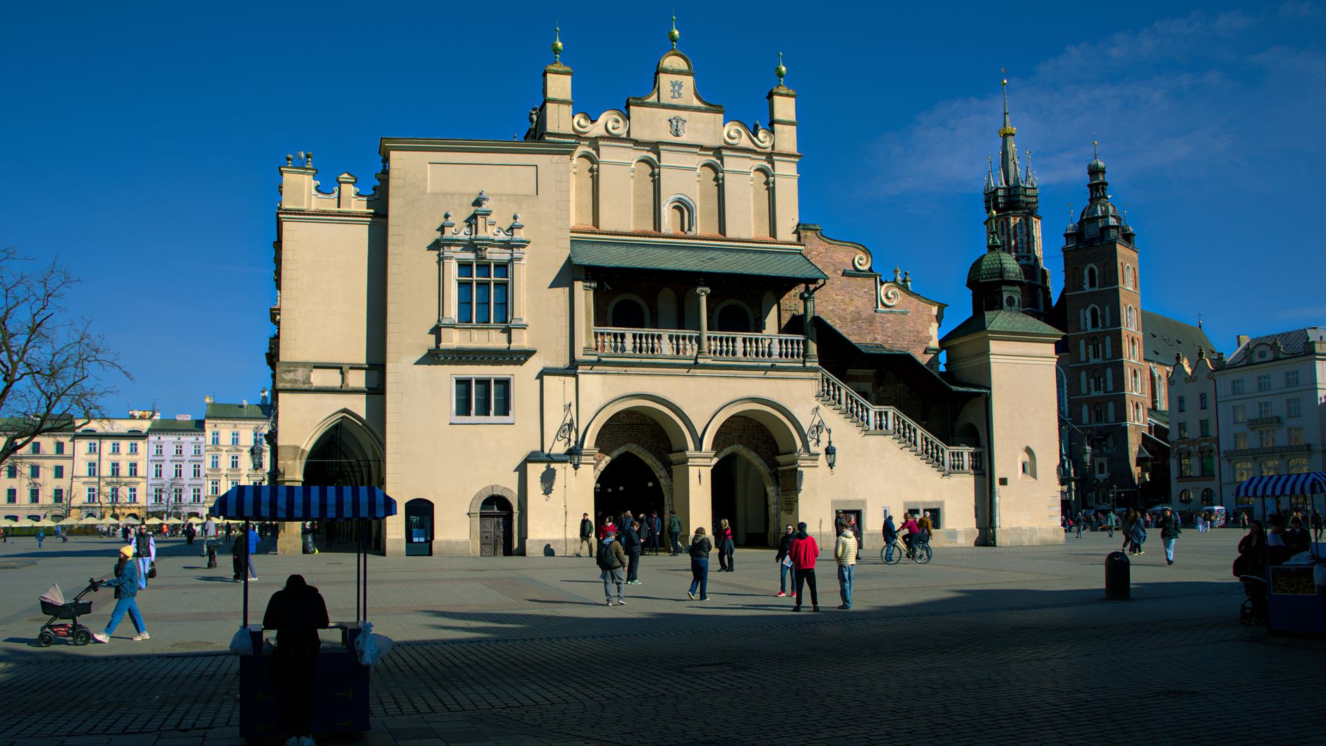 The Renaissance Cloth Hall on Krakow's Main Market Square, its arcades and carved parapet lit by low sun