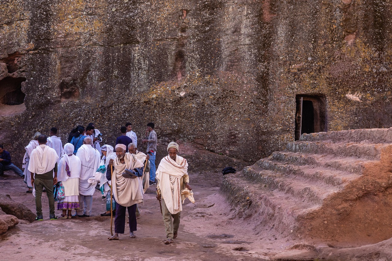 Pilgrims in white shawls gathered in the rock trenches of Lalibela
