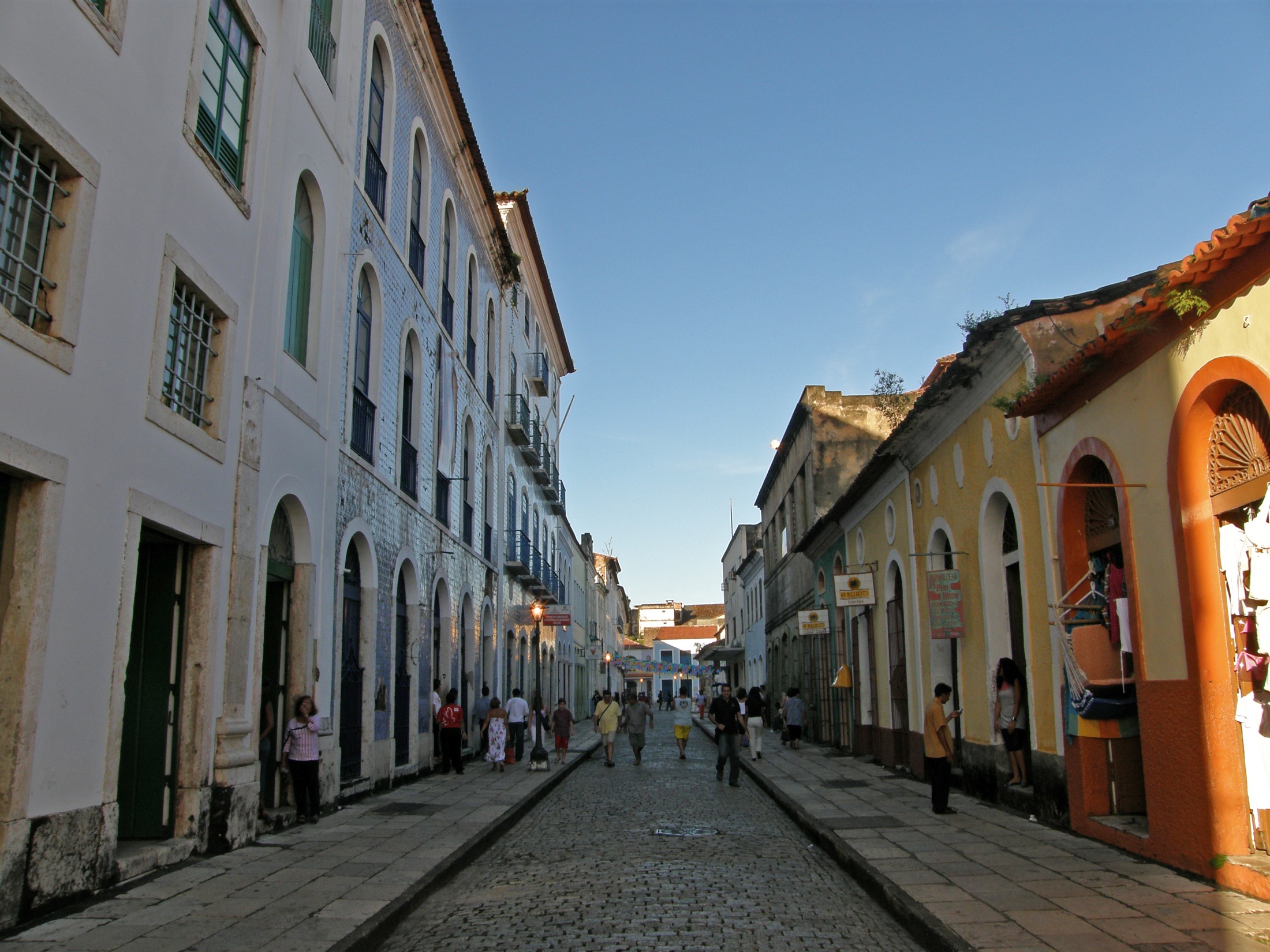 A cobbled street in the tiled colonial old town of São Luís, azulejo-fronted buildings on either side