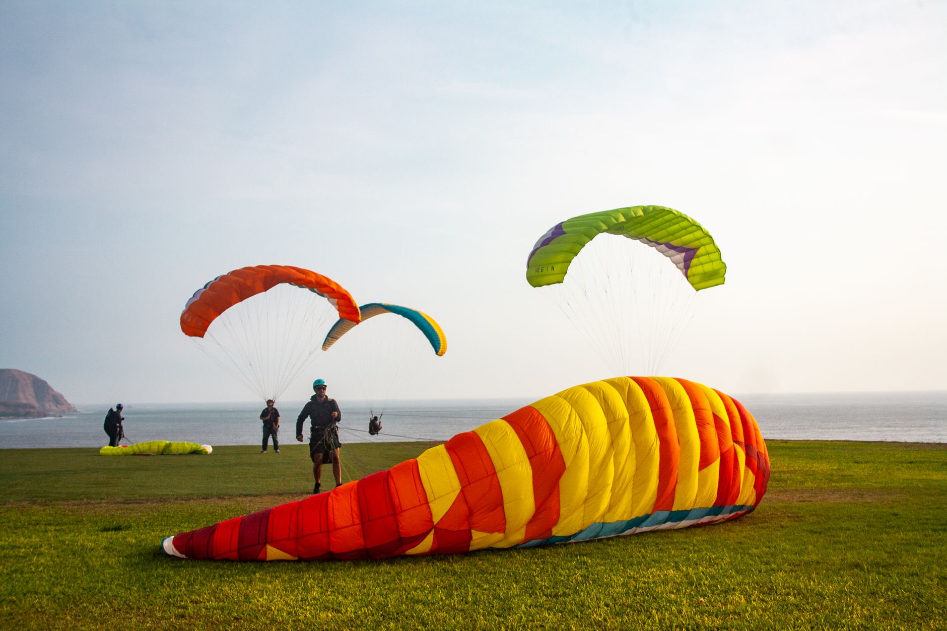 Paragliders laid out on the grass of the Malecón in Miraflores
