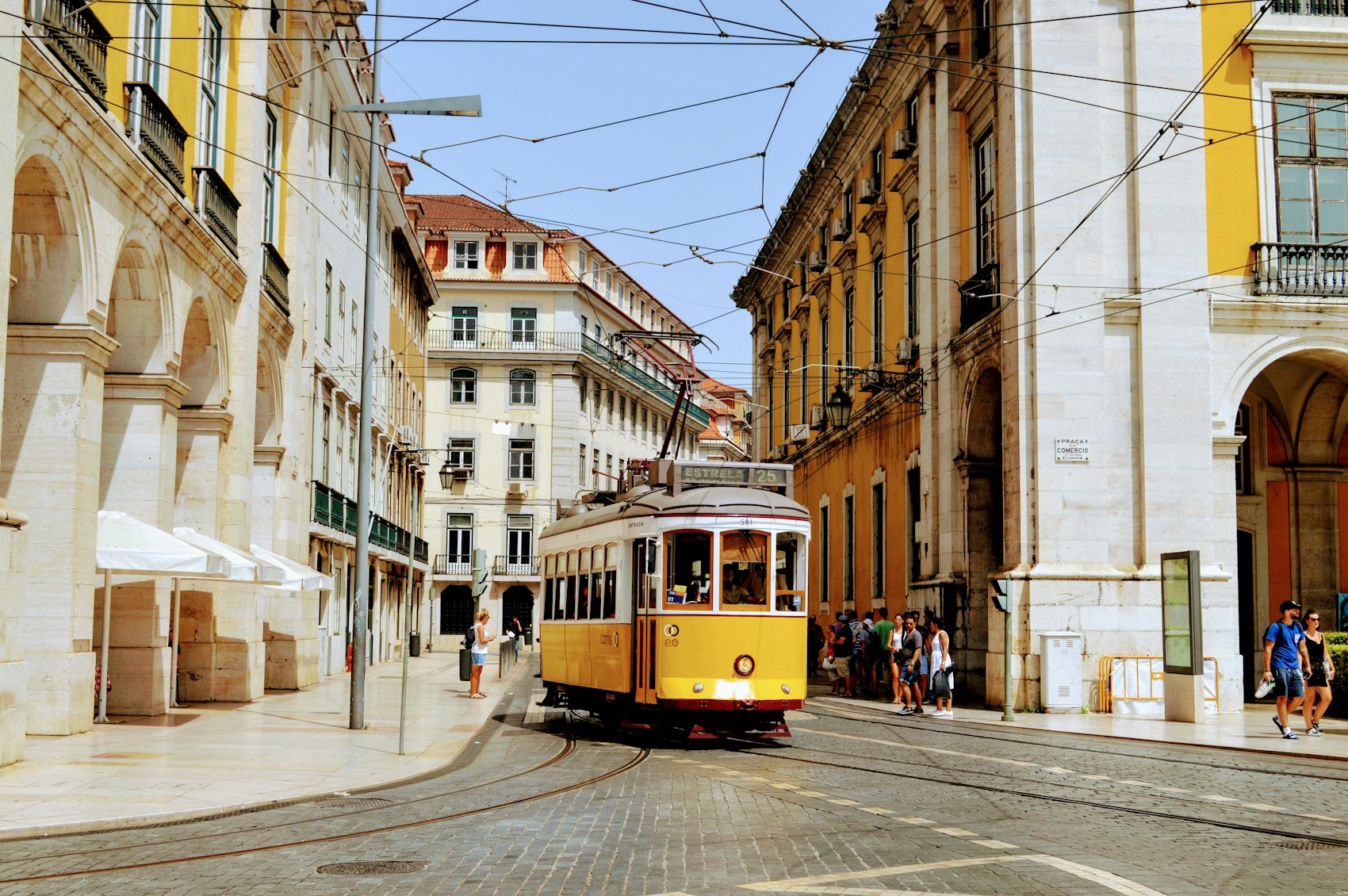 A yellow number 28 tram in the Baixa district of Lisbon