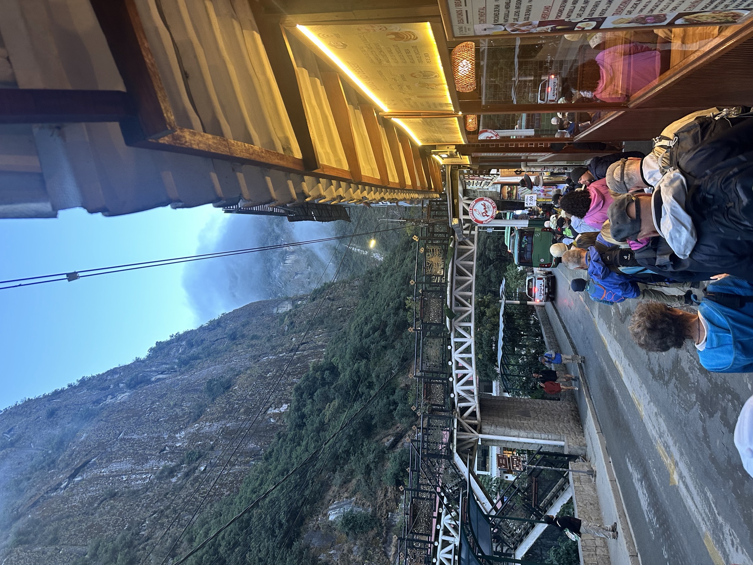 The bridge and bus station area in Aguas Calientes at dawn, where the bus up the mountain departs