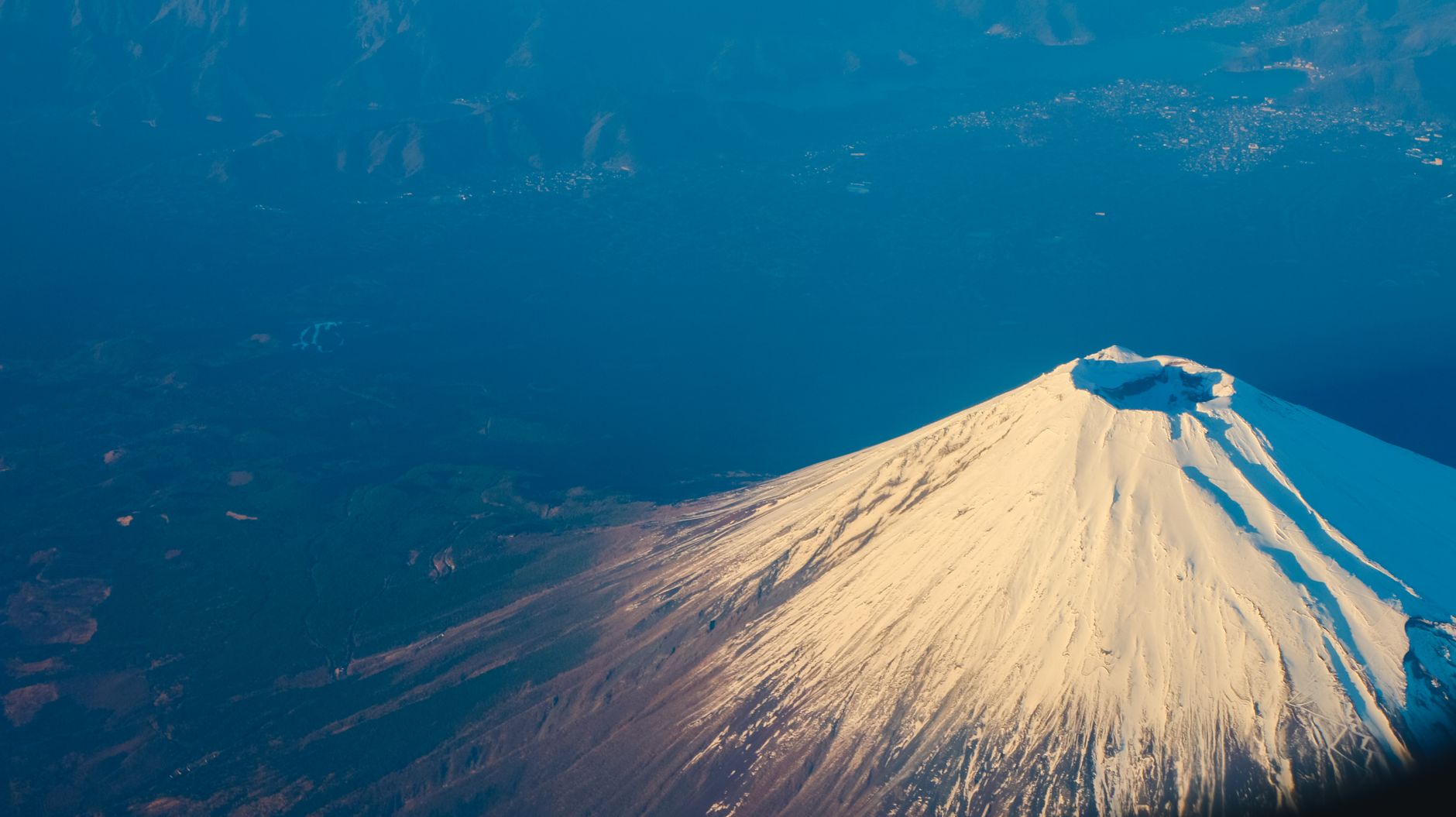 Mount Fuji's snow-covered summit seen from the air