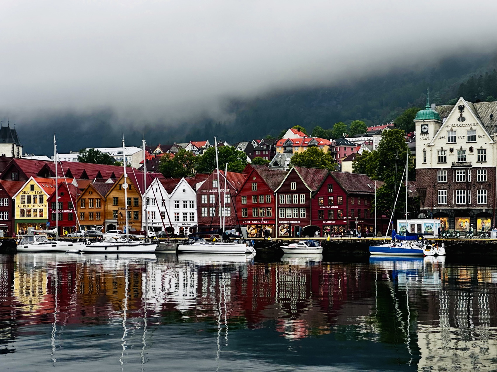 The wooden Hanseatic warehouses of Bryggen leaning over the Bergen waterfront
