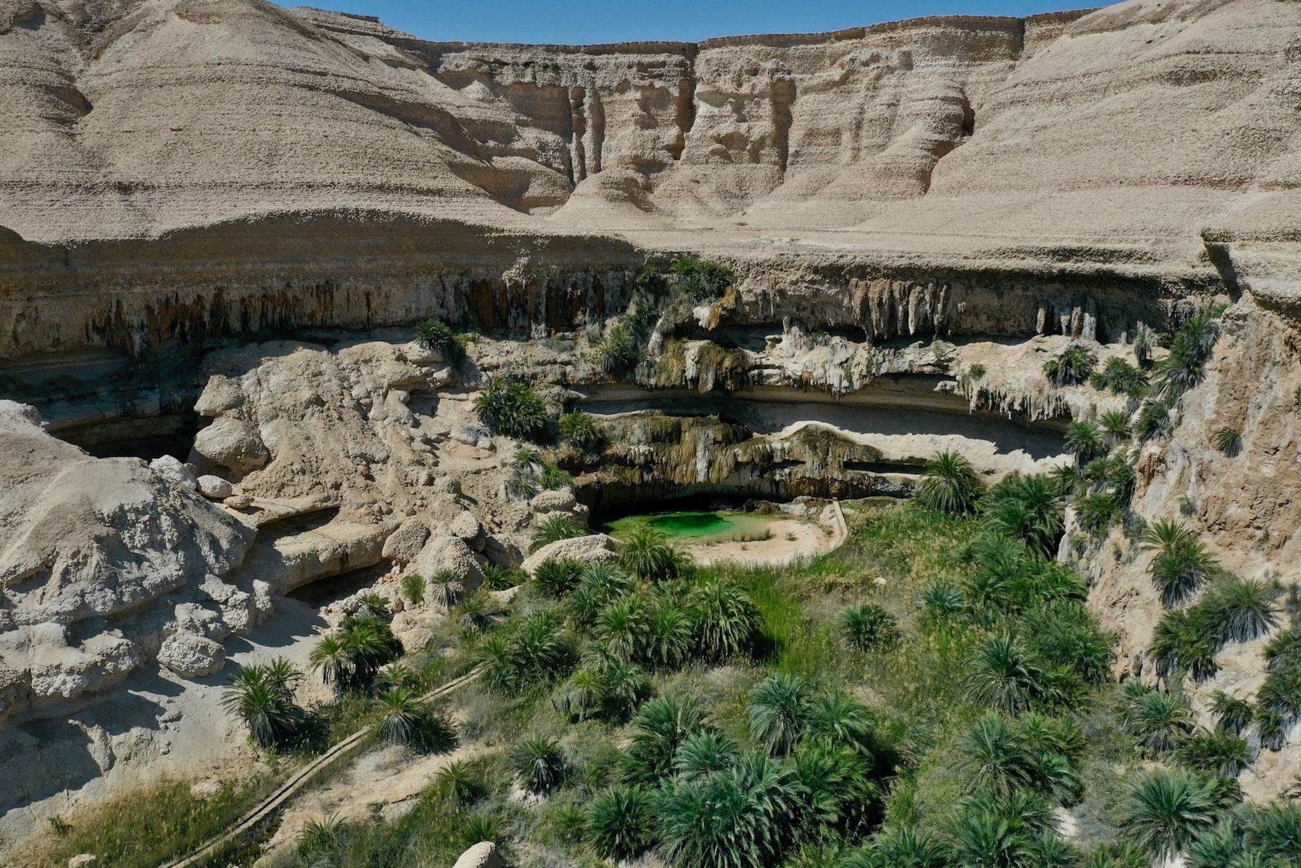 Aerial of the turquoise pools in the canyon of Wadi Shab, Oman