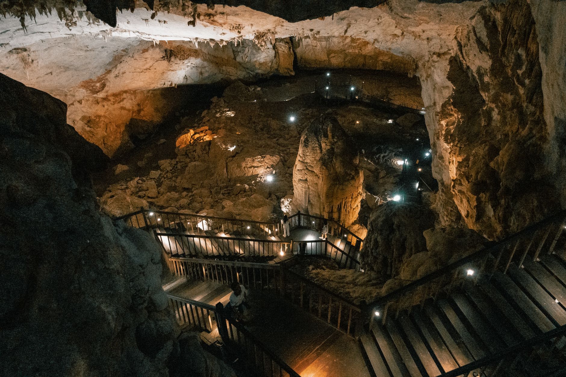 Illuminated stalactites and boardwalk inside Paradise Cave, Phong Nha