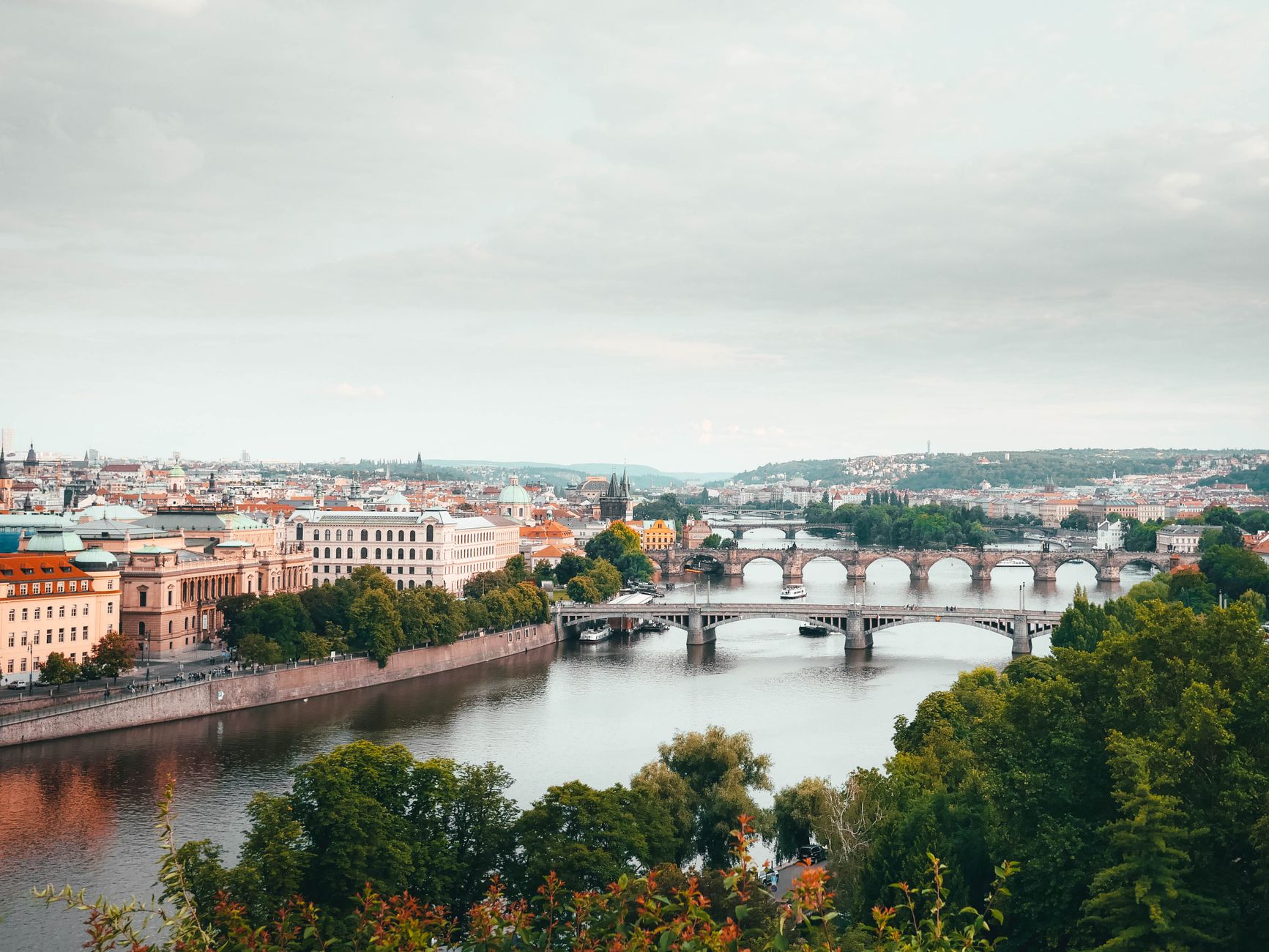 The Vltava river curving through Prague with several bridges crossing it