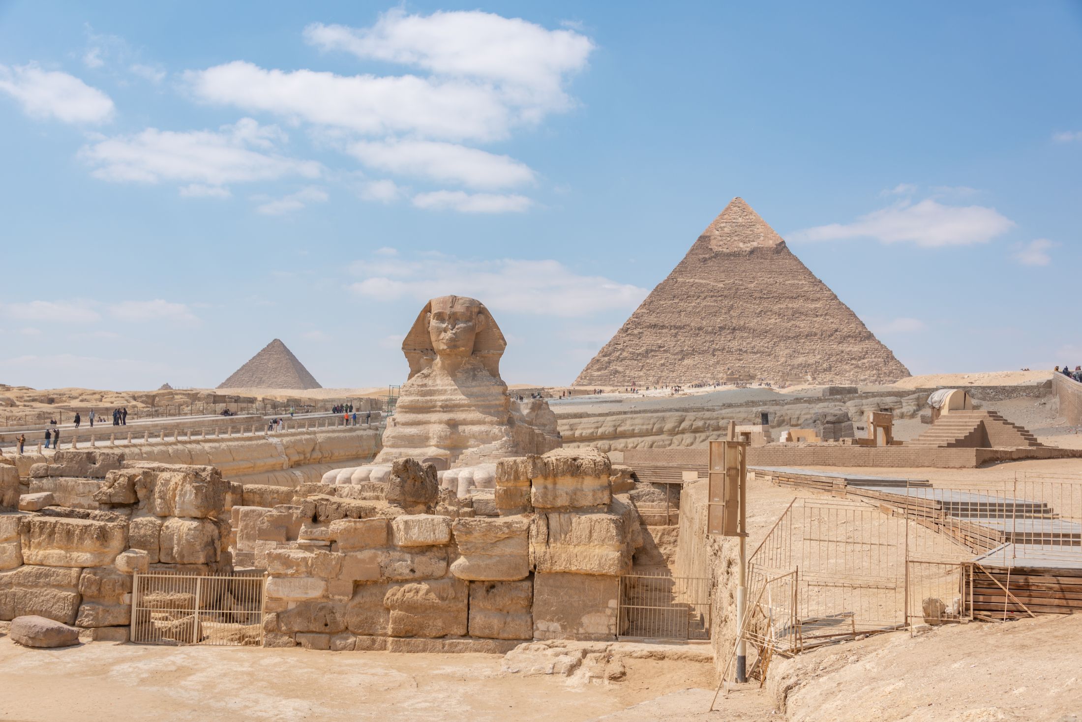 The Great Sphinx of Giza in profile with the Pyramid of Khafre rising behind it