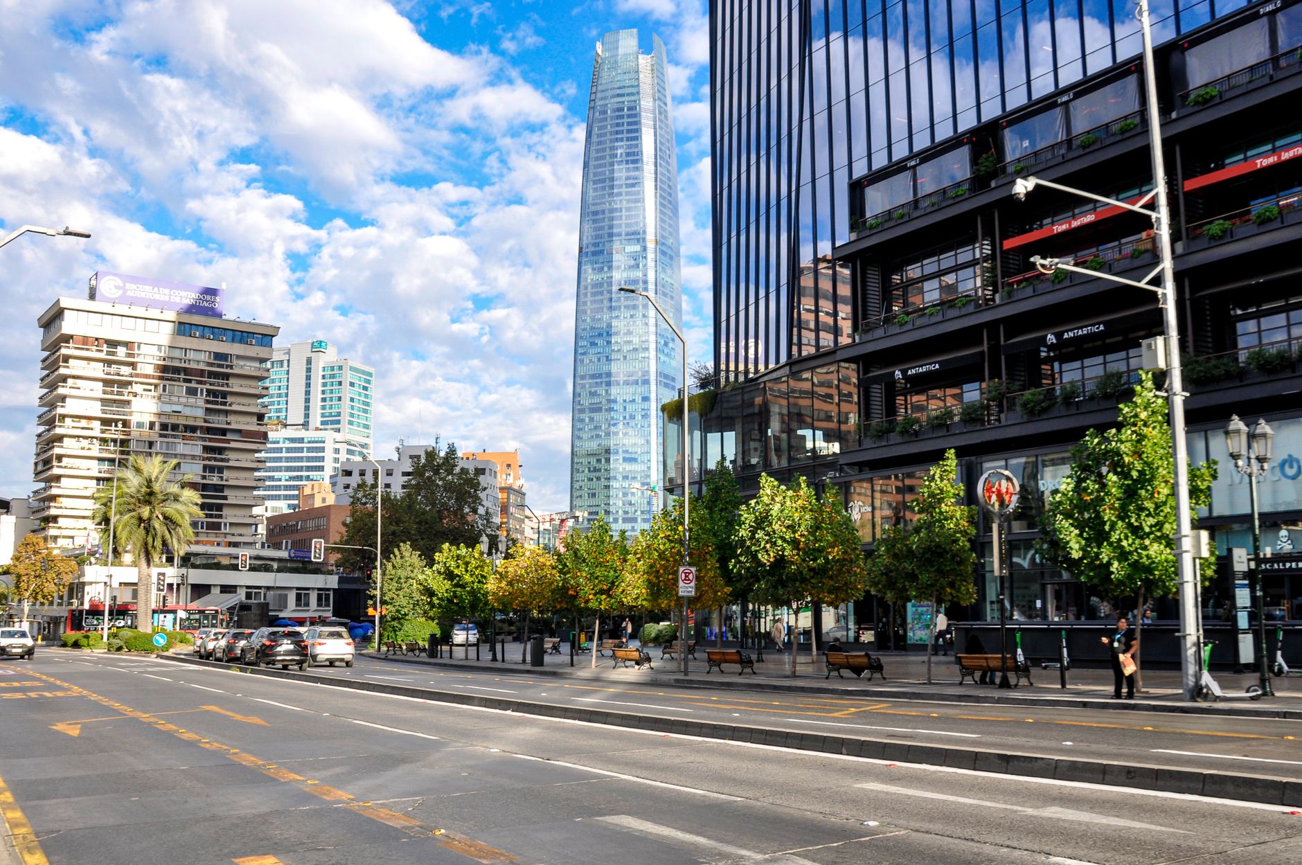 A Providencia street with the Costanera Center tower behind it