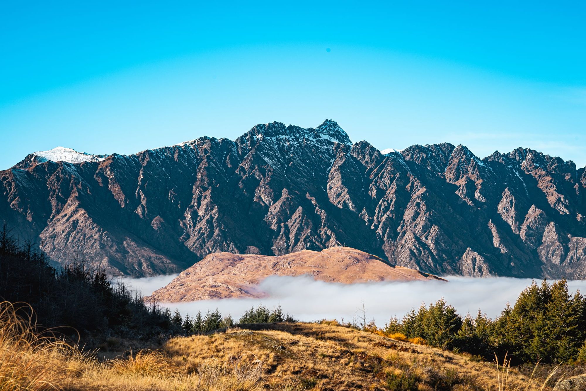 The jagged ridge of the Remarkables above a cloud inversion near Queenstown