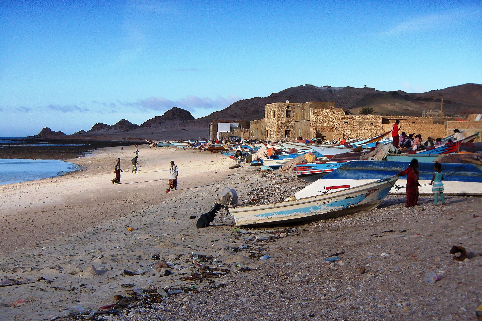Fishing boats drawn up on the sand at the village of Qalansiyah on Socotra