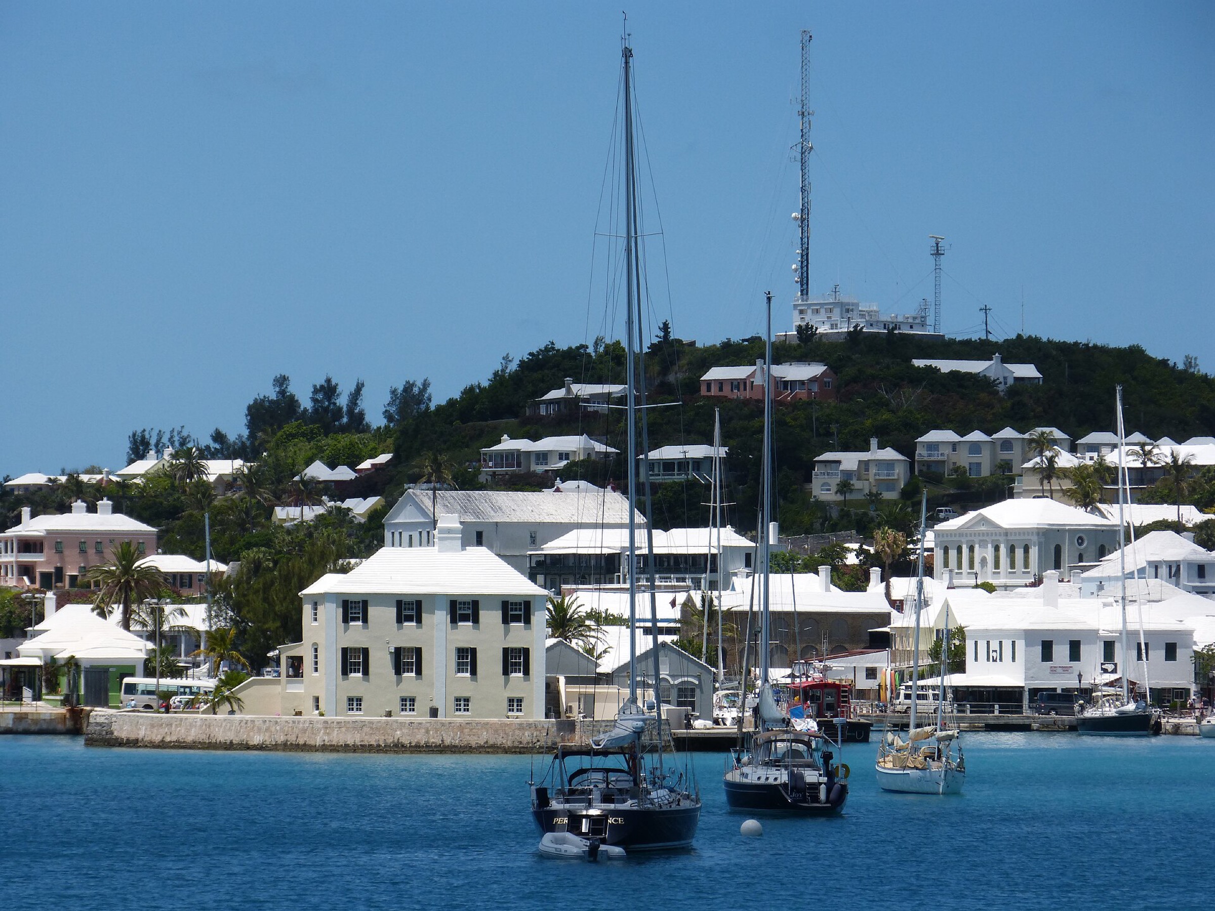 St. George's from the harbour, with Ordnance Island in front of the town and Fort George on the hill above the roofs