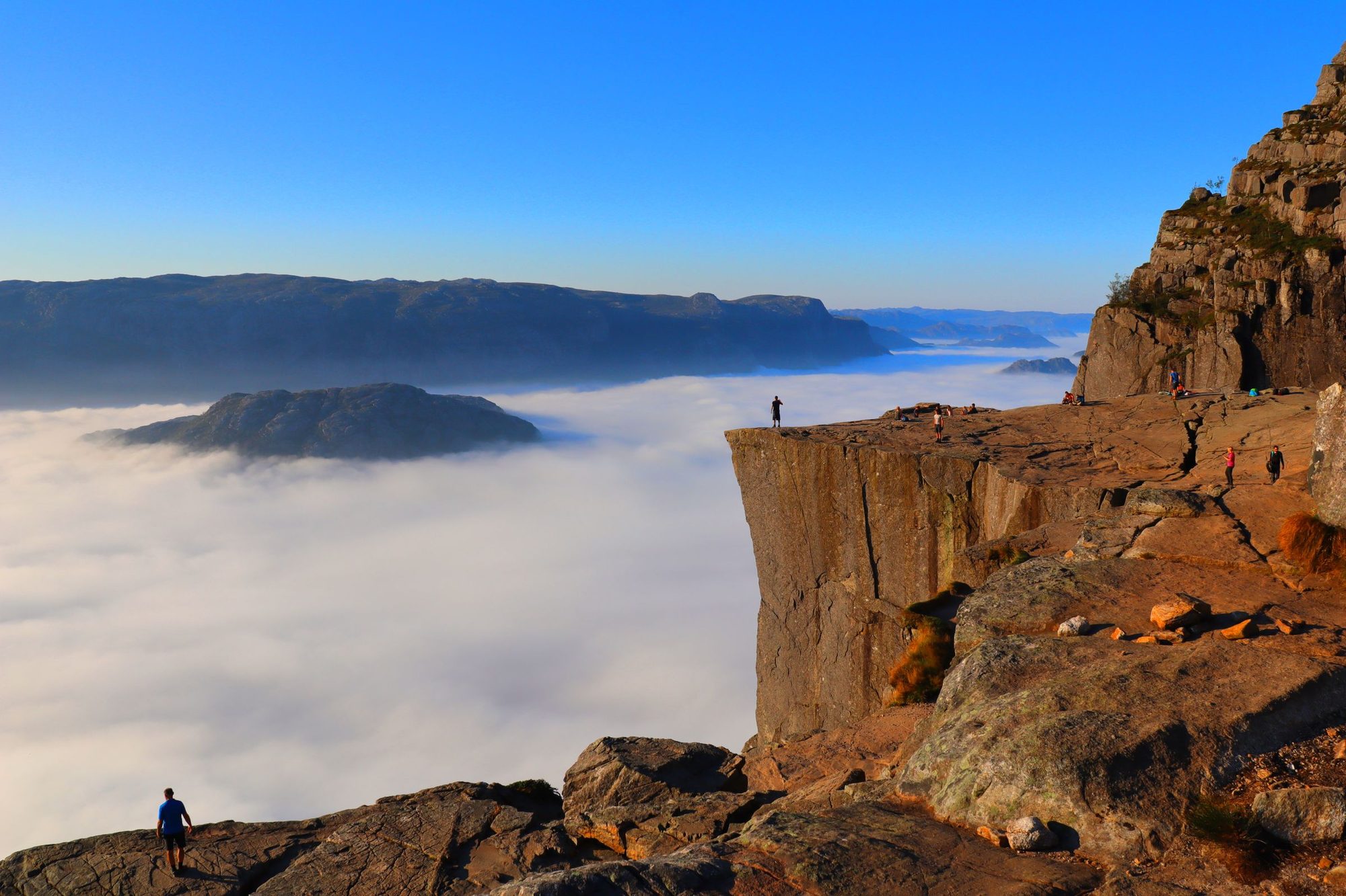 Preikestolen, the flat shelf of rock above the Lysefjord, with cloud filling the fjord below