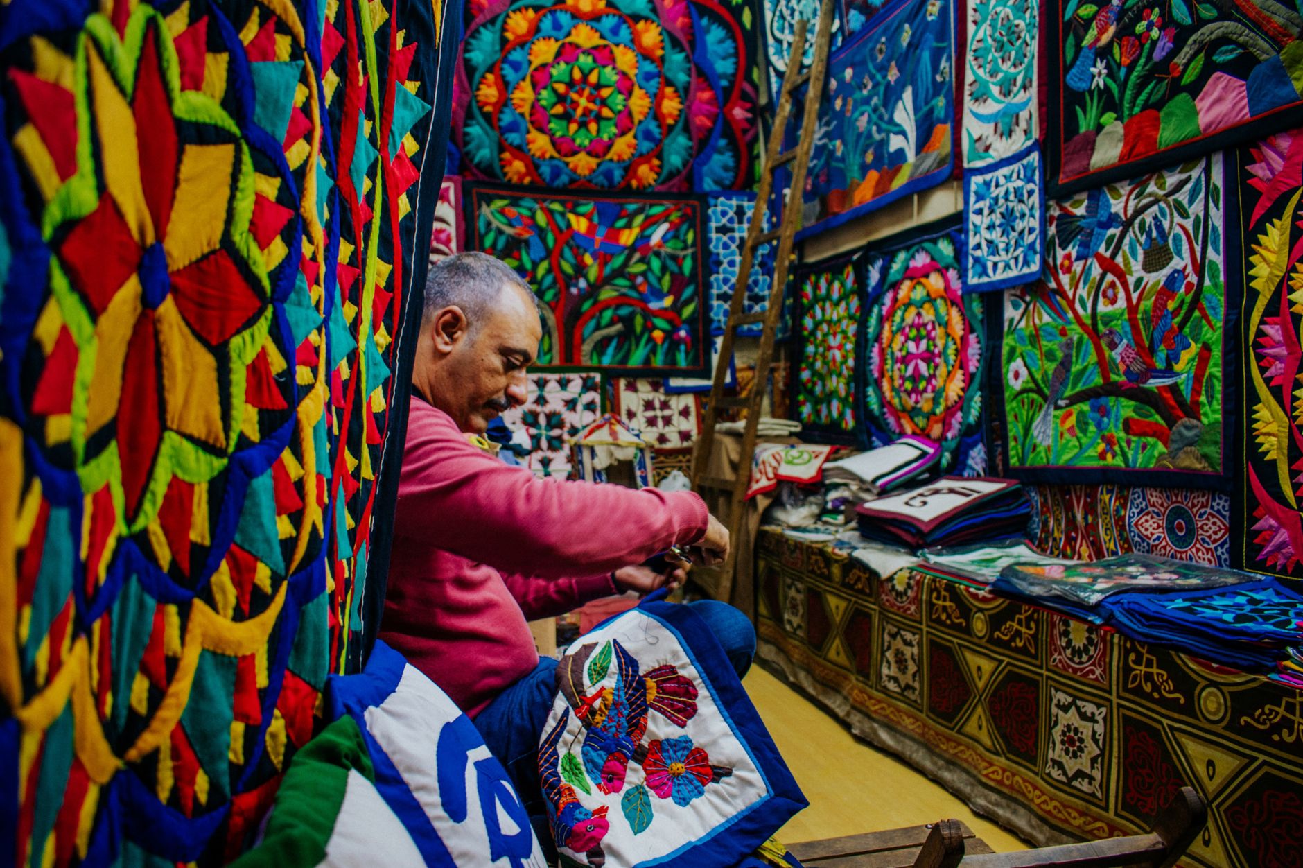Colourful embroidered textiles and carpets in an Uzbek bazaar shop