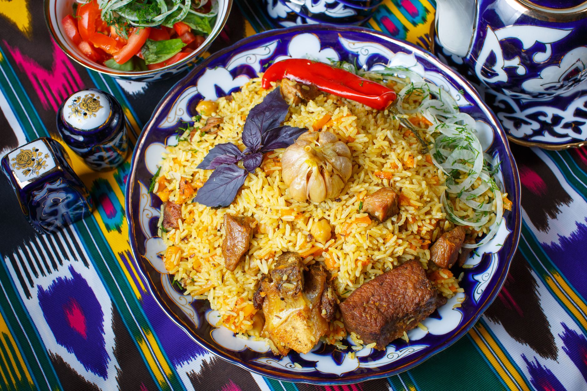 A platter of Uzbek plov, rice with mutton, carrot and chickpeas