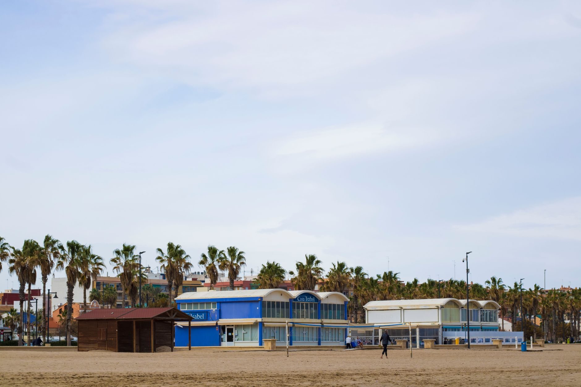Palm trees and beach restaurants on Passeig de Neptú, at the El Cabanyal end of the city beach